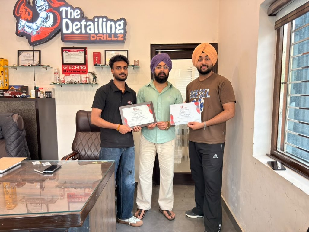 The Detailing Drillz Certified Graduates holding official certificates